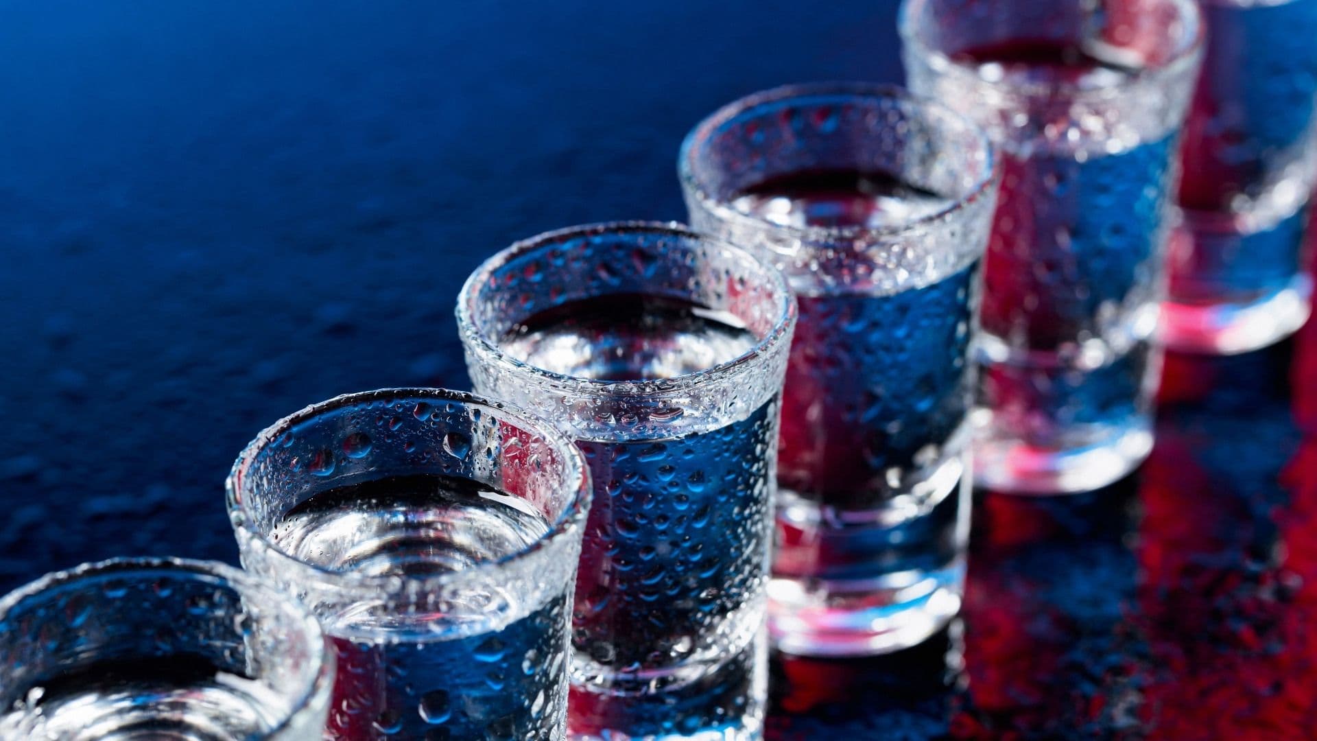 shots of vodka lined up on the bar